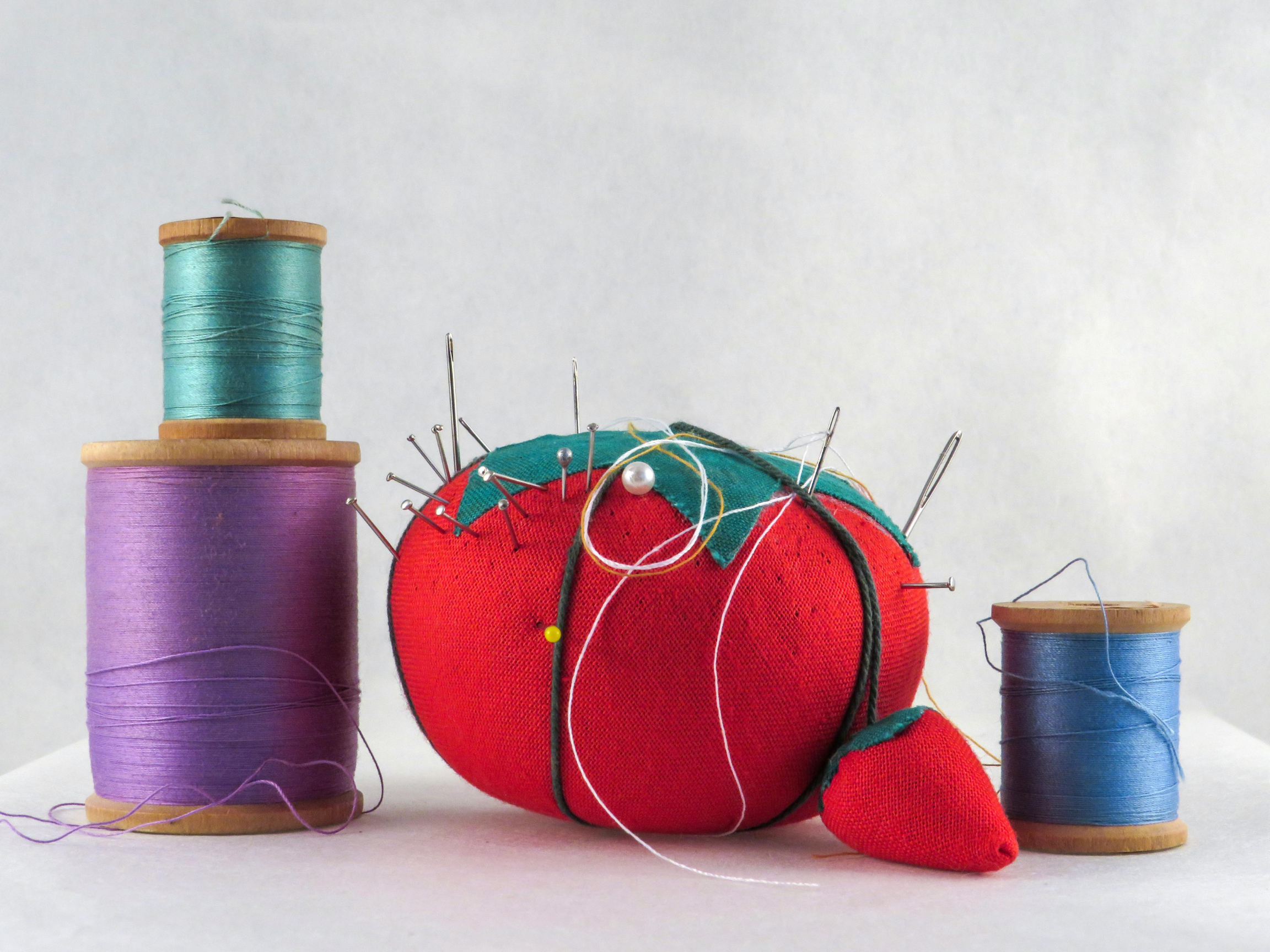 Sewing tools and materials on a work surface